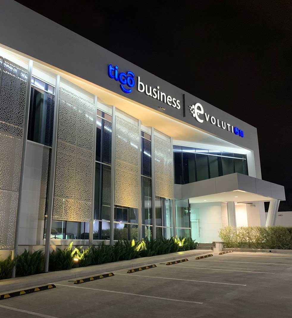 Image of Milicom building at night from the parking lot. Image of Milicom building at night from the parking lot.