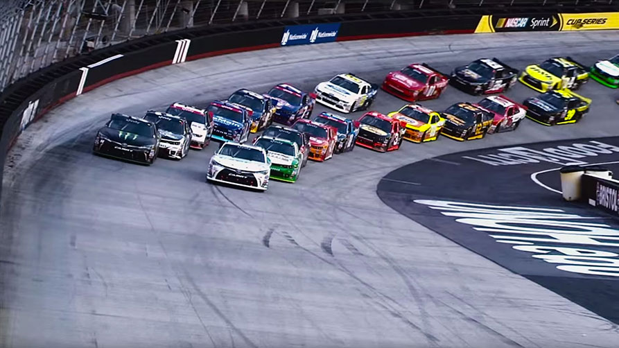 Image of race cars lined up on a race track ready to take off Image of race cars lined up on a race track ready to take off